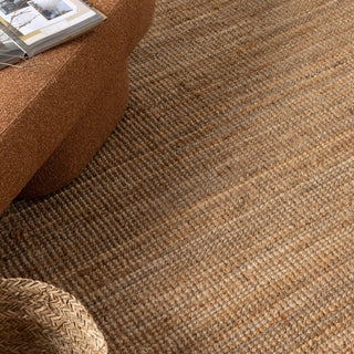 Bengal Natural Jute Rug in a minimalist living room setting