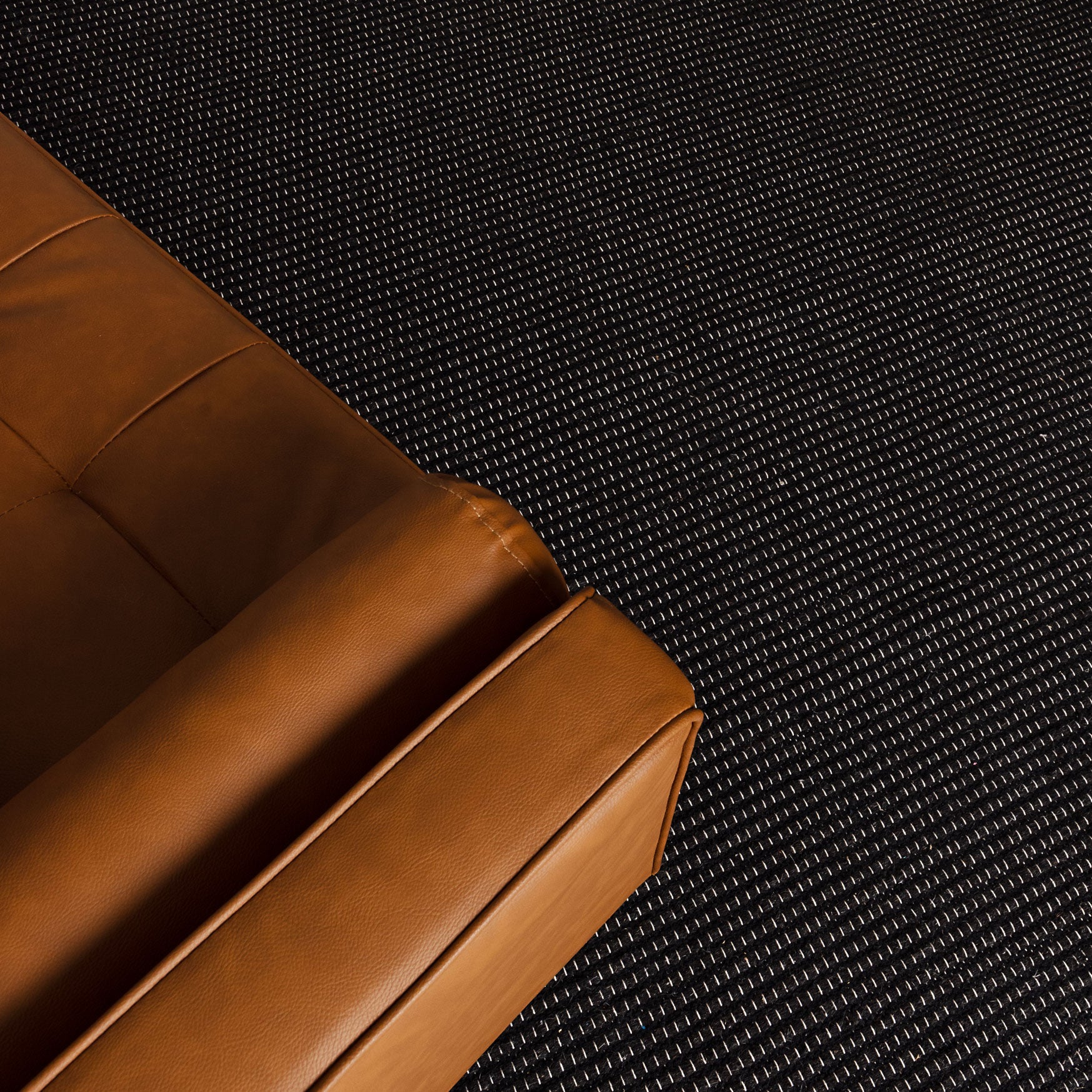 Close up view of the Natura Black Wool Rug 