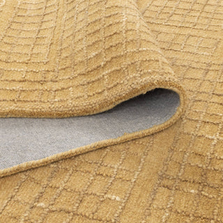 Close-up of the Abasco Citron Wool Rug's high-low knotted texture