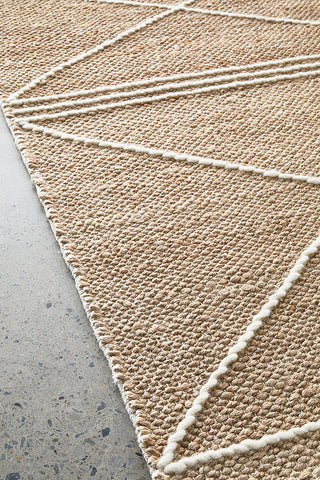 Darren Palmer Earth Natural Rug detailed view on concrete flooring