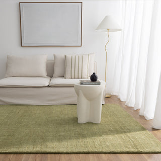 Abasco Green Knitted Wool Rug displayed in a living room