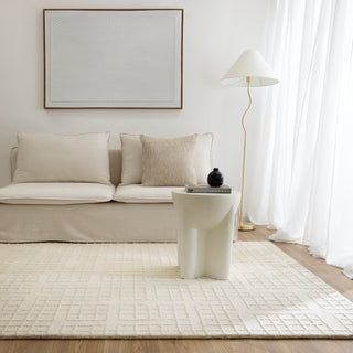 Abasco Ivory Knitted Wool Rug styled in a living room