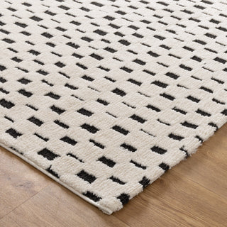 Close-up of geometric square design of the Mila Black and Cream Rug