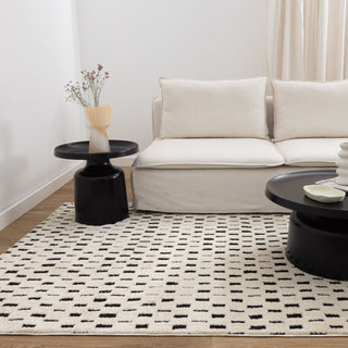 Mila Monochrome Squares Rug styled in a modern living room