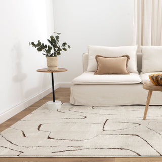 Mila Rug styled in a modern living room with neutral furniture