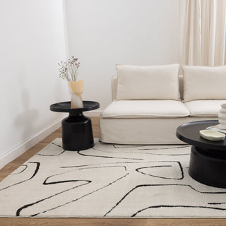 Mila Modern Lines Cream and Black Rug in contemporary living room