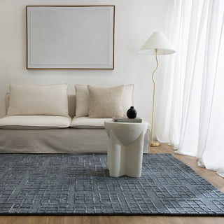 Abasco Steel Blue Rug adding a modern touch to a minimalist living room.