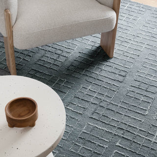 Detailed view of Abasco Steel Blue Wool Rug highlighting its luxurious underfoot feel.