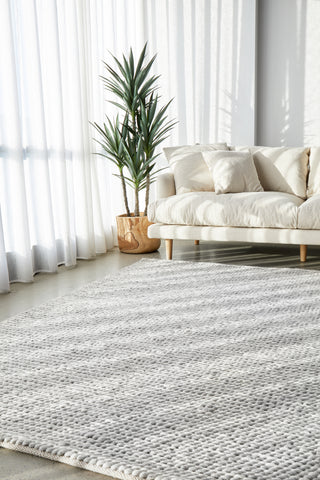 Carina Grey & Ivory Braided Wool Rug in modern living room - Adds warmth and texture with its chunky design