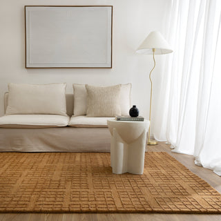 Abasco Sudan Brown Rug adding warmth and elegance to a living room.