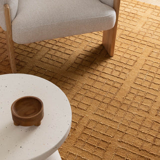 The Abasco Sudan Brown Rug’s rich color and design enhancing a neutral-toned room.