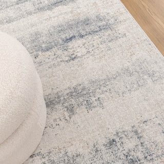 Styled close-up of Toscana Beige Blue Rug in a living space.