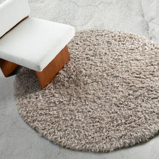 Nakoni Beige Shag Round Rug by Loopsie on Concrete Floor